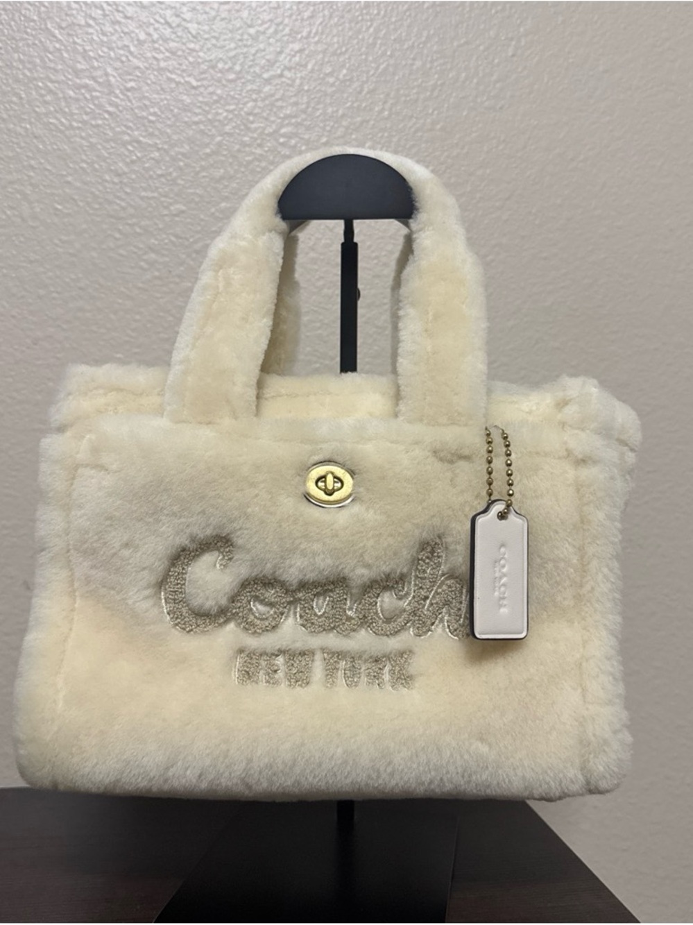 COACH Cream Shearling Tote with Gold Turnlock and Logo Tag